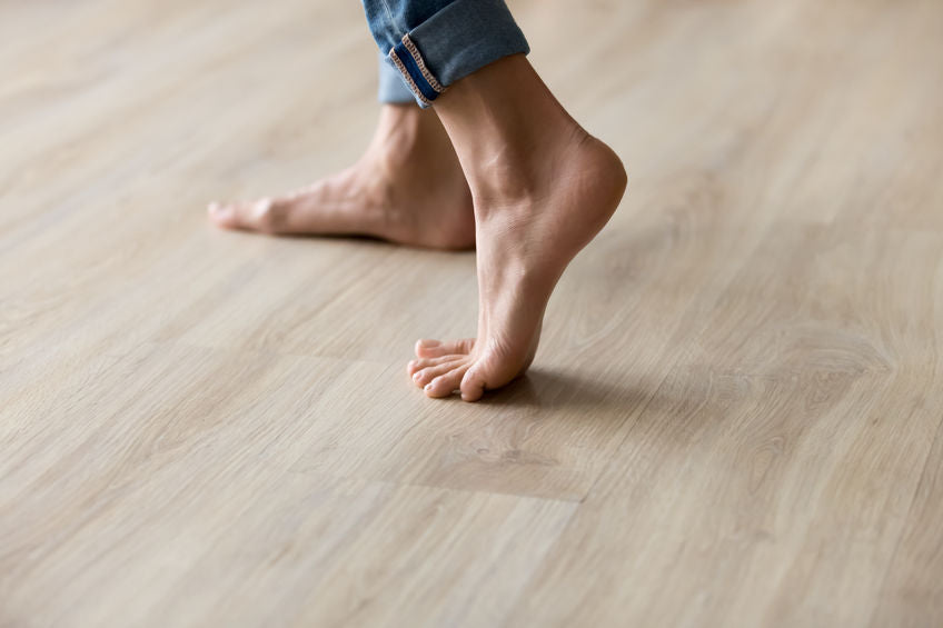 Prevent a couch from sliding around on a slippery laminate floor
