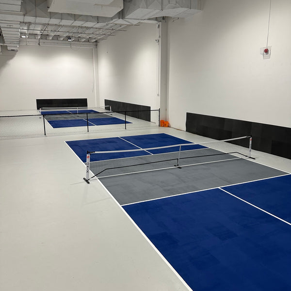 What are pickleball courts made of?